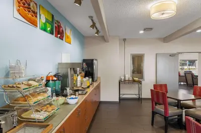 a kitchen with a counter with a bunch of food at Quality Inn Denver Northeast Brighton in Brighton