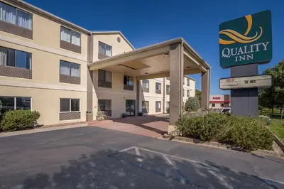a building with a sign for a quality inn at Quality Inn Denver Northeast Brighton in Brighton