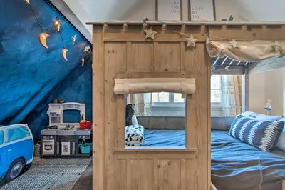 a bedroom with a wooden bunk bed in a room at Outdoor Kitchen and Swim Spa 1-Acre Grand Lake Home in Grand Lake