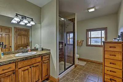 a bathroom with a shower and a sink at Golf, Ski and Hike Luxe Group Getaway in Granby! in Granby