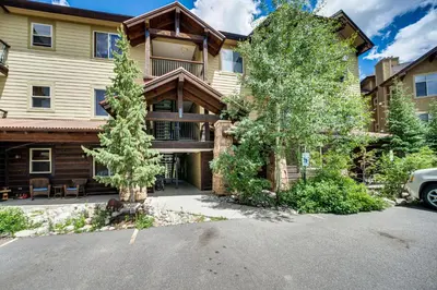 a house with a car parked in front of it at Four-Season Winter Park Condo with Pool Access! in Winter Park