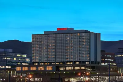 a building with a red sign on top of it at Sheraton Denver West Hotel in Lakewood