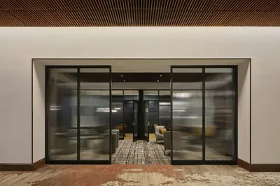 an entrance to a building with two glass doors at Sheraton Denver West Hotel in Lakewood