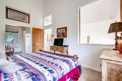 a bedroom with a bed and a desk at Hot Tub and Grilling Area Keystone Townhome! in Keystone