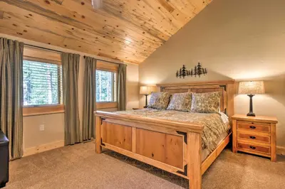 a bedroom with a large bed in a room at Luxury 4 BR Cabin 2 King Suites on Shuttle Route in Winter Park