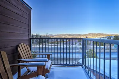 a balcony with two chairs and a view of the water at Walk to Main Street Frisco Townhome with Decks in Frisco