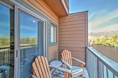 two chairs sitting on the balcony of a house at Walk to Main Street Frisco Townhome with Decks in Frisco