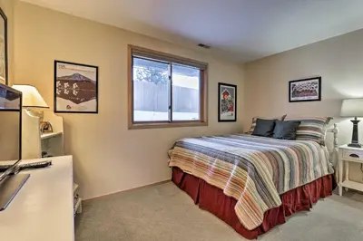 a bedroom with a bed and a window at Walk to Main Street Frisco Townhome with Decks in Frisco
