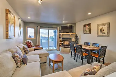 a living room with a couch and a table at Walk to Main Street Frisco Townhome with Decks in Frisco