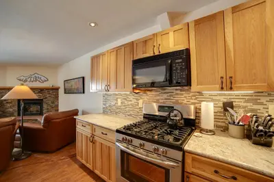 a kitchen with a stove and a microwave at 1 Mi to Main Street Mtn-View Home in Frisco in Frisco