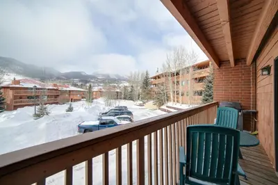 a balcony with a view of a snow covered parking lot at 1 Mi to Main Street Mtn-View Home in Frisco in Frisco