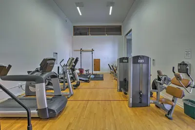 a gym with several treadmills and cardio machines at 1 Mi to Main Street Mtn-View Home in Frisco in Frisco
