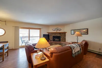 a living room with a couch and a fireplace at 1 Mi to Main Street Mtn-View Home in Frisco in Frisco