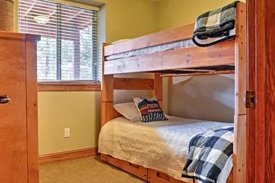 a bedroom with two bunk beds in a house at Fraser Townhome with Mtn Views - 6 Mi to Winter Park in Fraser