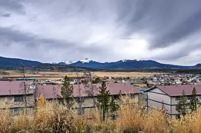 a view of a town with mountains in the background at Fraser Townhome with Mtn Views - 6 Mi to Winter Park in Fraser