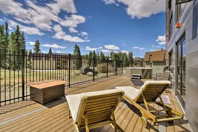 a deck with two chairs and a table and a grill at Winter Park Condo on Bus Route, 2 Blocks to Dtwn! in Winter Park
