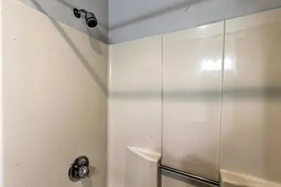 a shower stall in a bathroom with at Winter Park Condo on Bus Route, 2 Blocks to Dtwn! in Winter Park