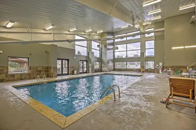 a large indoor swimming pool in a building at Winter Park Condo on Bus Route, 2 Blocks to Dtwn! in Winter Park