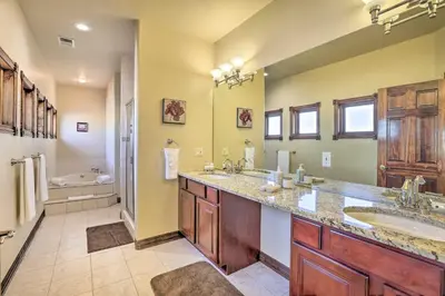 a bathroom with two sinks and a tub at 10 Mi to Barr Lake State Park Home with Mtn Views in Hudson