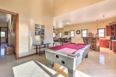 a living room with a pool table in it at 10 Mi to Barr Lake State Park Home with Mtn Views in Hudson