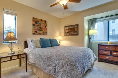 a bedroom with a bed and a dresser and a window at Englewood Apt with Patio in Denver Tech Center in Englewood