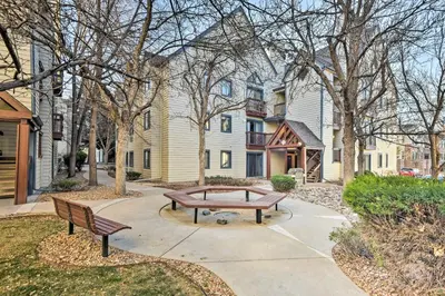 a park with two benches in front of a building at Englewood Apt with Patio in Denver Tech Center in Englewood