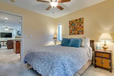 a bedroom with a bed and a ceiling fan at Englewood Apt with Patio in Denver Tech Center in Englewood