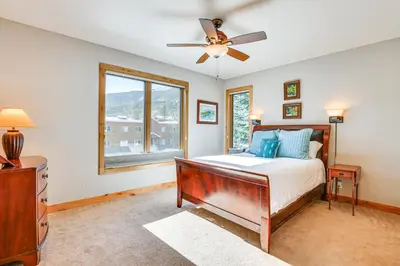 a bedroom with a bed and a ceiling fan at Dtwn Frisco Home with Mtn View, 11 Mi to Ski Breck! in Frisco