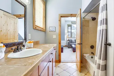 a bathroom with a sink and a tub at Dtwn Frisco Home with Mtn View, 11 Mi to Ski Breck! in Frisco