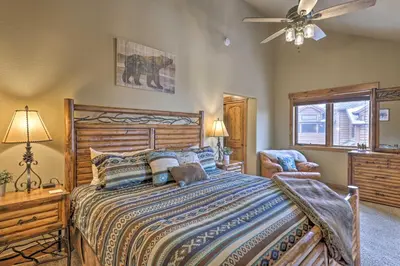 a bedroom with a large bed and a ceiling fan at Colorado Escape with Mtn Views! 3 Mi to Winter Park in Fraser