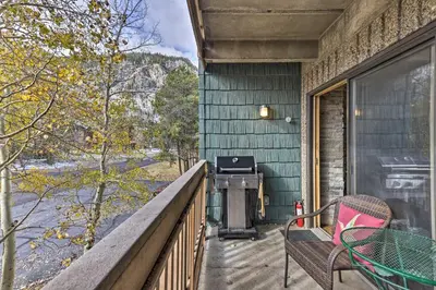 a grill on the balcony of a green house at Steps to Ski Shuttle! Frisco Condo with Indoor Pool in Frisco