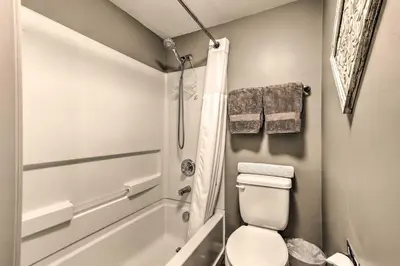 a small bathroom with a toilet and a shower at Steps to Ski Shuttle! Frisco Condo with Indoor Pool in Frisco