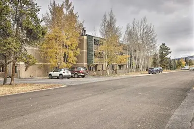 an empty street with cars parked on the side of a building at Steps to Ski Shuttle! Frisco Condo with Indoor Pool in Frisco