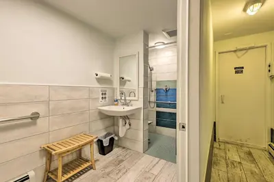 a bathroom with a sink and a shower at Steps to Ski Shuttle! Frisco Condo with Indoor Pool in Frisco
