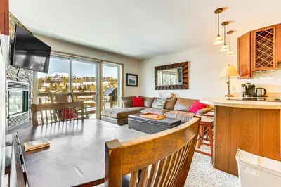 a kitchen and a living room with a table at Dillon Reservoir On-Site Central and Scenic Condo! in Dillon