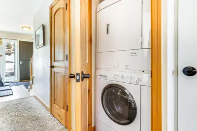 a laundry room with a washer and dryer at Dillon Reservoir On-Site Central and Scenic Condo! in Dillon