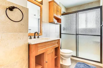 a bathroom with a toilet and a sink and a shower at Dillon Reservoir On-Site Central and Scenic Condo! in Dillon