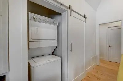 a white laundry room with a washer and dryer at Fireplace and Deck Modern Cabin in Grand Lake! in Grand Lake