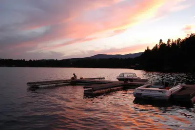a couple of boats parked at a dock on a lake at Fireplace and Deck Modern Cabin in Grand Lake! in Grand Lake