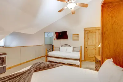 a bedroom with two beds and a ceiling fan at The Inn at Silver Creek Resort Retreat with Balcony! in Granby