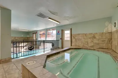 a swimming pool in the middle of a building at The Inn at Silver Creek Resort Retreat with Balcony! in Granby