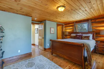 a bedroom with a bed and a wooden ceiling at Access to Rocky Mtn Natl Park Grand Lake Cabin in Grand Lake