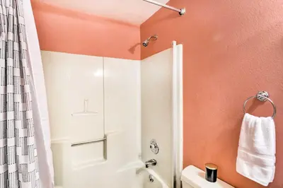 a bathroom with a shower and a toilet at Winter Park Studio Condo - 5 Mins to Downtown! in Winter Park