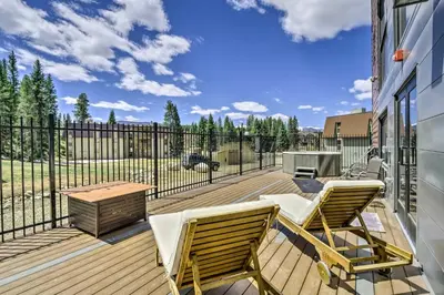 a deck with two chairs and a table at Winter Park Studio Condo - 5 Mins to Downtown! in Winter Park