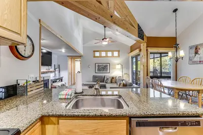 a kitchen with a sink and a living room at Ski Shuttle and Mountain Views Keystone Resort Home in Keystone