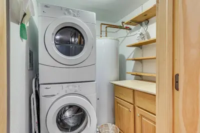 a washing machine and a washer and dryer in a kitchen at Ski Shuttle and Mountain Views Keystone Resort Home in Keystone