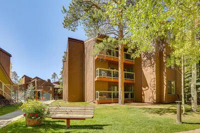a park bench in front of a building at Ski Shuttle and Mountain Views Keystone Resort Home in Keystone