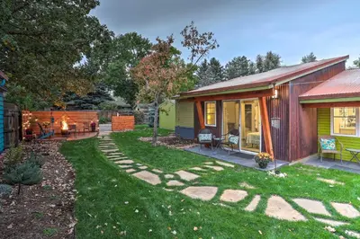 a home with a yard with a house at Fort Collins Vacation Rental with Private Hot Tub! in Fort Collins