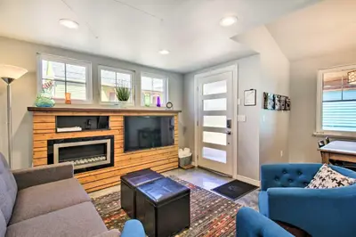 a living room with a couch and a tv at Fort Collins Vacation Rental with Private Hot Tub! in Fort Collins