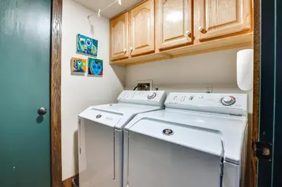 a small laundry room with a washer and dryer at 11 Mi to Slopes Frisco Home with Hot Tub and Sauna! in Frisco